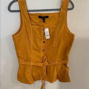 White House Black Market Mustard Yellow Top. Out stock